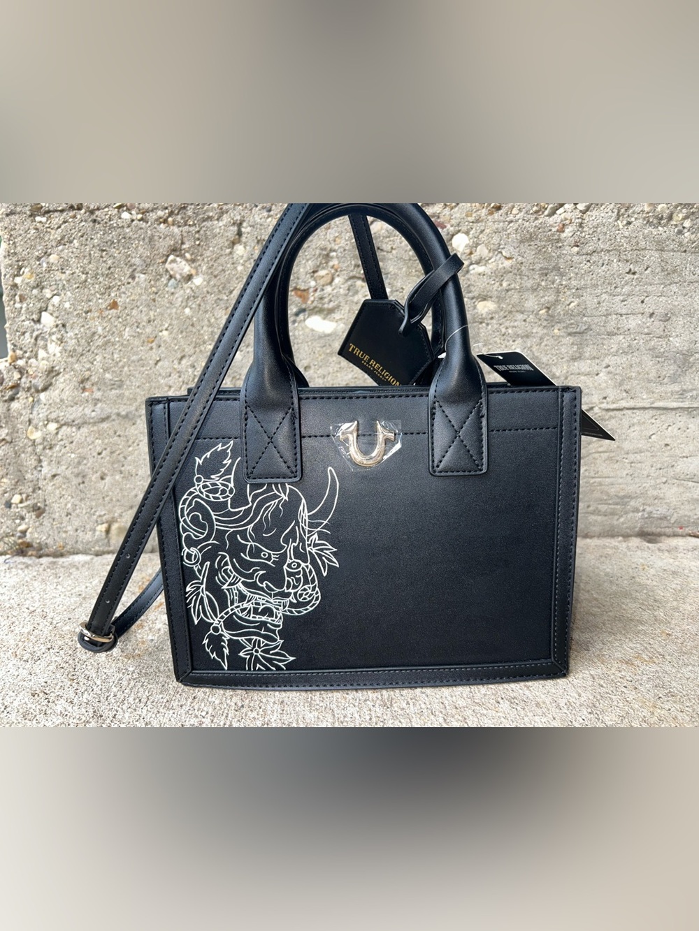 True Religion Black Satchel with White Graphic Demon Motif